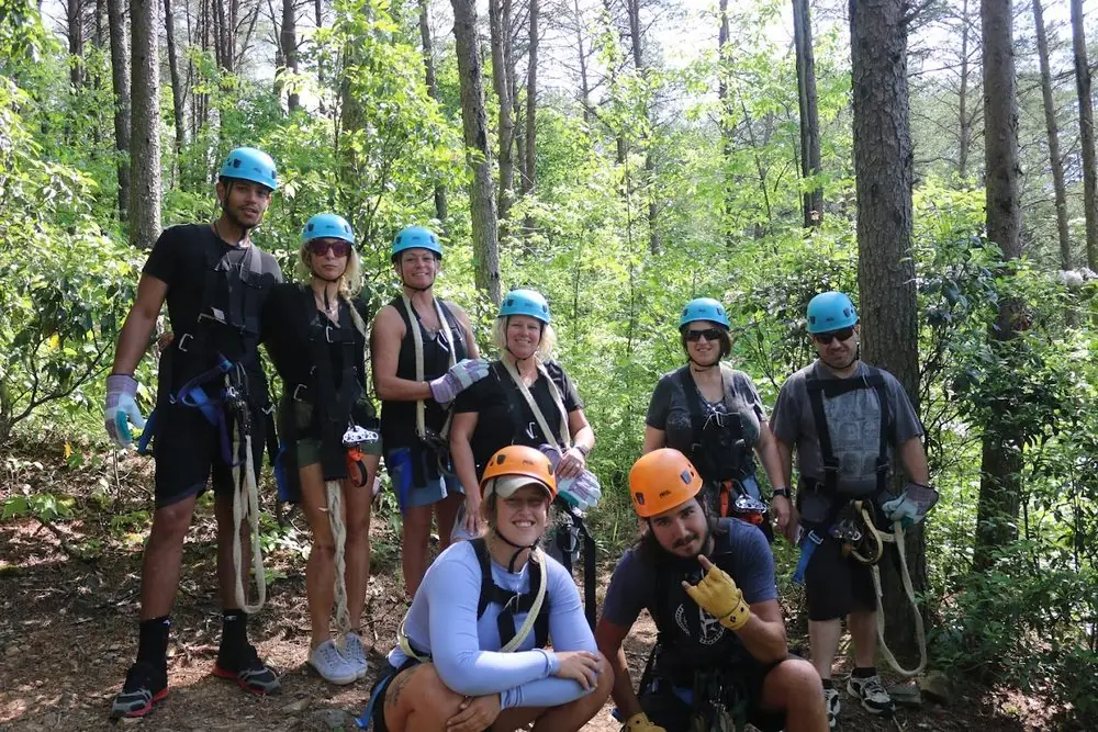 Guides and guests geared up for the canopy tour