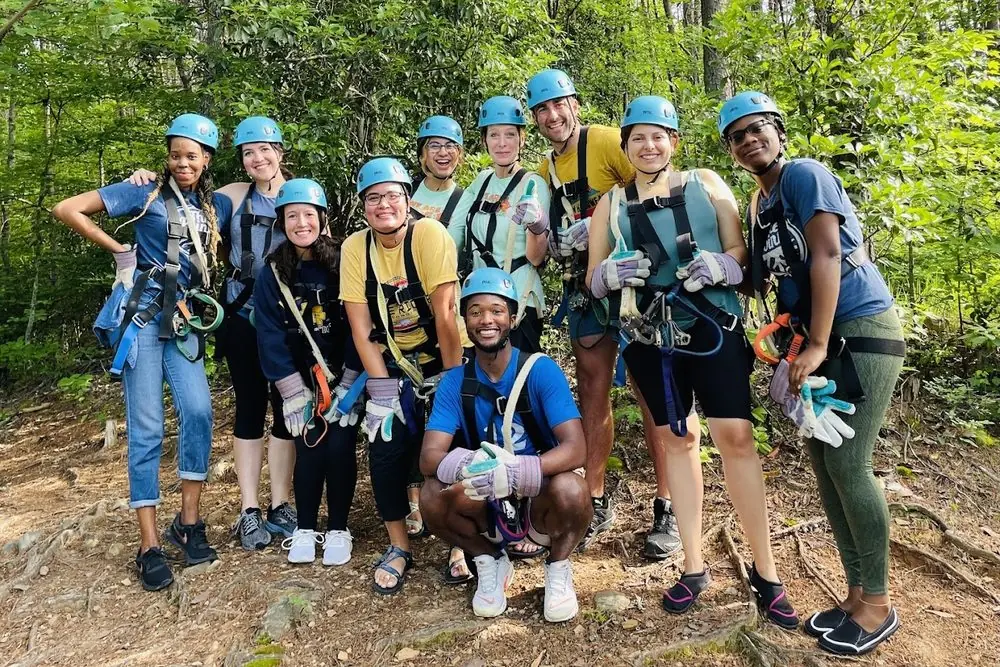 A large group geared up for the Ocoee zipline canopy tour