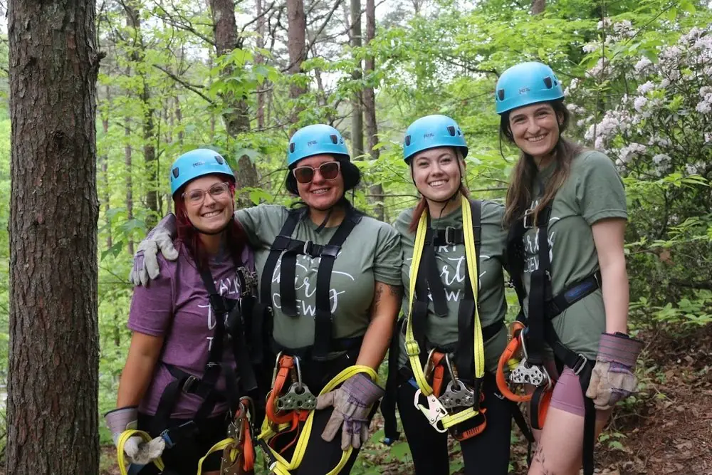 Four guests ready to zip through the Ocoee canopy