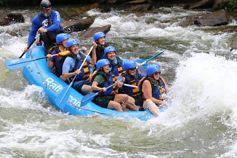 A guided raft punching through Class III–IV rapids on the Ocoee River